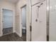 Modern shower with white tiled walls, glass door, and multiple shower head settings at 1624 Little Wren Ln, Winter Park, FL 32792