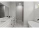 Bathroom features a double sink vanity, soaking tub and glass-enclosed shower at 17397 Sw 41St Cir, Ocala, FL 34473