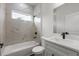 Updated bathroom featuring a shower with marble-look tile and quartz counters at 17397 Sw 41St Cir, Ocala, FL 34473
