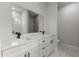 Bright bathroom showcasing a double sink vanity and tiled shower at 17397 Sw 41St Cir, Ocala, FL 34473