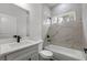 Well-lit bathroom with marble-look shower and quartz countertop vanity at 17397 Sw 41St Cir, Ocala, FL 34473