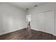 Bedroom with wood-look floors and a closet for storage solutions at 17397 Sw 41St Cir, Ocala, FL 34473