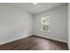 Cozy bedroom featuring wood-look flooring and a bright window to the yard at 17397 Sw 41St Cir, Ocala, FL 34473