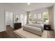 Relaxing bedroom showcasing neutral tones, a plush bed, and modern furnishings at 17397 Sw 41St Cir, Ocala, FL 34473