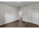 This bedroom boasts wood-look floors and a closet for ample storage at 17397 Sw 41St Cir, Ocala, FL 34473