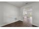 Open-concept living room with laminate flooring offering an inviting area for relaxation and entertainment at 17397 Sw 41St Cir, Ocala, FL 34473