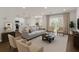 Open-concept living room with modern decor, flowing seamlessly into the kitchen and dining area, great for entertaining at 17397 Sw 41St Cir, Ocala, FL 34473