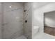 Close-up of a tiled shower stall with glass door and a soaking tub at 17397 Sw 41St Cir, Ocala, FL 34473