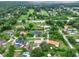 Aerial view featuring neighborhood homes surrounded by lush lawns and mature trees providing shade at 1778 Woodcrest Ln, Deland, FL 32720