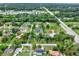 Scenic aerial of neighborhood showcasing homes with lush yards, mature trees, and a tranquil setting at 1778 Woodcrest Ln, Deland, FL 32720