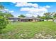 The backyard has a pool inside of a screened-in enclosure at 1778 Woodcrest Ln, Deland, FL 32720