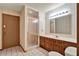 A simple bathroom features a shower, tile floors, neutral walls, and a wooden vanity at 1778 Woodcrest Ln, Deland, FL 32720