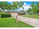 Charming single-story brick home featuring an attached two-car garage and inviting front porch at 1778 Woodcrest Ln, Deland, FL 32720