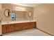 An oversized bathroom features a double sink vanity with tile flooring and bright lighting at 1778 Woodcrest Ln, Deland, FL 32720