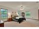 The primary bedroom features multiple bright windows that provide natural light throughout at 1778 Woodcrest Ln, Deland, FL 32720