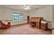 Bright office space with neutral-toned walls, a roll-top desk, and a large window at 1778 Woodcrest Ln, Deland, FL 32720