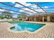 Backyard featuring a screened in pool with brick pavers and view of the covered patio at 1778 Woodcrest Ln, Deland, FL 32720