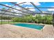 Backyard features a screened in pool with brick pavers and a surrounding green yard at 1778 Woodcrest Ln, Deland, FL 32720