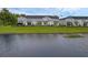 Aerial shot of townhomes backing up to a lake showing green space and black aluminum fencing at 1932 Terrapin Rd, Ocoee, FL 34761
