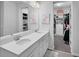 Bright bathroom featuring dual sinks, vanity with ample storage, and a walk-in closet at 1932 Terrapin Rd, Ocoee, FL 34761