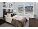 Modern bedroom with art and sleek dark wood furnishings at 1932 Terrapin Rd, Ocoee, FL 34761