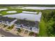 Modern townhome community with garages facing a pond, providing scenic views and a tranquil atmosphere for residents at 1932 Terrapin Rd, Ocoee, FL 34761