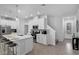 Modern kitchen with stainless steel appliances and a breakfast bar seating area at 1932 Terrapin Rd, Ocoee, FL 34761