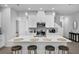 Modern kitchen with white cabinetry, stainless appliances, and a large center island at 1932 Terrapin Rd, Ocoee, FL 34761