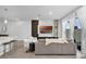 Comfortable living area with entertainment center, seamlessly connected to the kitchen at 1932 Terrapin Rd, Ocoee, FL 34761