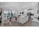 Open concept living space with sliding glass doors and a modern kitchen island at 1932 Terrapin Rd, Ocoee, FL 34761
