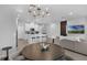 Open living space featuring a kitchen, dining area, and modern living room at 1932 Terrapin Rd, Ocoee, FL 34761