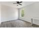 Bright bedroom with neutral colors, carpet, a desk and a window overlooking a yard at 1932 Westpointe Cir, Orlando, FL 32835