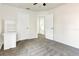 Bright bedroom with neutral colors, carpet, and a view of a doorway leading to a staircase at 1932 Westpointe Cir, Orlando, FL 32835
