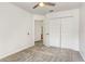 Bright bedroom with neutral colors, carpet, double closets and an doorway to the bathroom at 1932 Westpointe Cir, Orlando, FL 32835