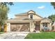 Charming two-story home featuring a well-manicured lawn, a brown garage door, and a cozy front porch area at 1932 Westpointe Cir, Orlando, FL 32835