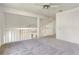Second floor hallway featuring neutral carpet, white walls, and an open railing at 1932 Westpointe Cir, Orlando, FL 32835