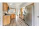 Bright kitchen with stainless steel appliances, tile backsplash and light wood cabinets and hardware at 1932 Westpointe Cir, Orlando, FL 32835