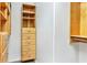 Walk-in closet with wood shelving and plenty of built-in storage for a well-organized wardrobe at 1932 Westpointe Cir, Orlando, FL 32835