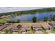 Aerial view of the property showcasing the home's roof, landscaping, and proximity to the lake at 2105 Lake Side Ave, Davenport, FL 33837