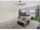 Spacious bedroom with ceiling fan, neutral carpet, and bright natural light from multiple windows at 2105 Lake Side Ave, Davenport, FL 33837