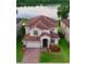 Two-story home with a terracotta tile roof and a well-maintained front lawn at 2105 Lake Side Ave, Davenport, FL 33837
