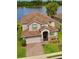 Charming home with a tile roof, well-maintained landscaping, and inviting entrance at 2105 Lake Side Ave, Davenport, FL 33837