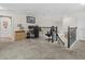 Spacious loft area with work-from-home space and a staircase with decorative iron railings at 2105 Lake Side Ave, Davenport, FL 33837