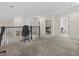 Open loft area with neutral carpeting and access to multiple rooms at 2105 Lake Side Ave, Davenport, FL 33837