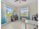 Office with two large windows providing ample natural light, tiled floors and a ceiling fan at 2105 Lake Side Ave, Davenport, FL 33837