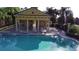 View of the pool and pool house at 2105 Lake Side Ave, Davenport, FL 33837