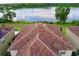 Tile roof with a view of the lake at 2105 Lake Side Ave, Davenport, FL 33837