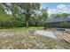 Backyard featuring a patio with built-in fire pit, and a screened in pool at 2180 Captain Dr, Deltona, FL 32738