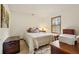 Comfortable bedroom with neutral walls, wood window trim, and carpet at 2180 Captain Dr, Deltona, FL 32738
