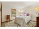 This bright bedroom features white walls, natural light from a window and neutral carpet at 2180 Captain Dr, Deltona, FL 32738